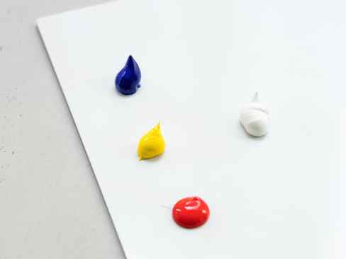 Dollops of Blue Yellow Red and White Acrylic Paint