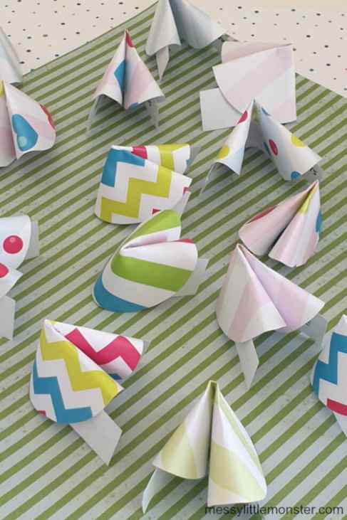 fortune cookies made with colorful paper with a white and green striped bacground