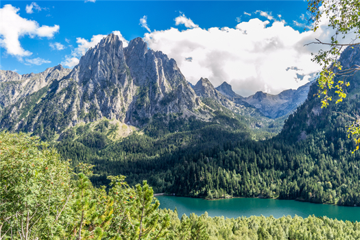 huge pyrenese mountains behind the estany de sant maurici