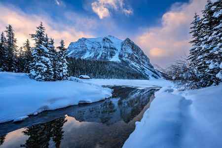 A view of the mountains in winter over Lake Louise, Canada
