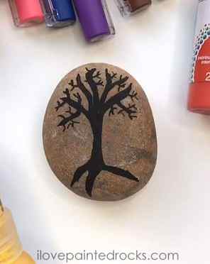 how to paint a tree with falling leaves on a rock