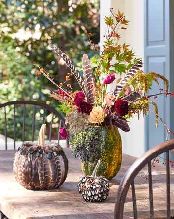 floral centerpieces in pumpkin vases halloween decor
