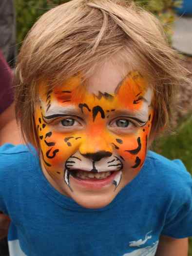 Tiger face paint by Auntie Stacey, Auntie Stacey