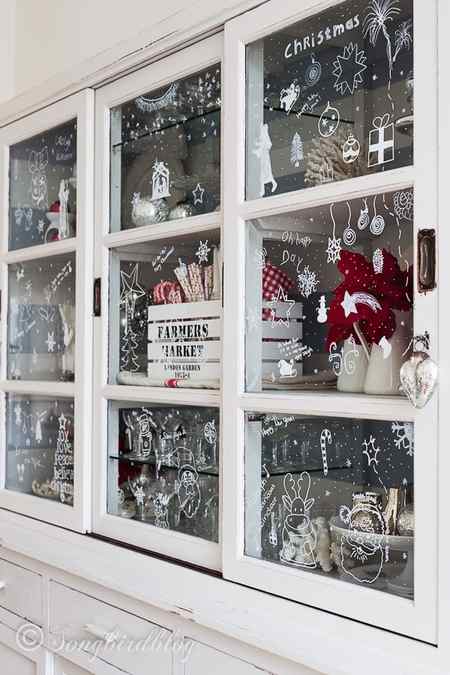 Christmas window decorations on hutch