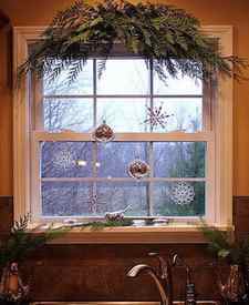 Natural Evergreen hanging above Christmas Kitchen Window 