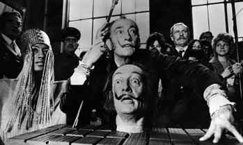 Spanish surrealist painter Salvador Dalí with a model of his own head, at a press conference in Paris, 1973.