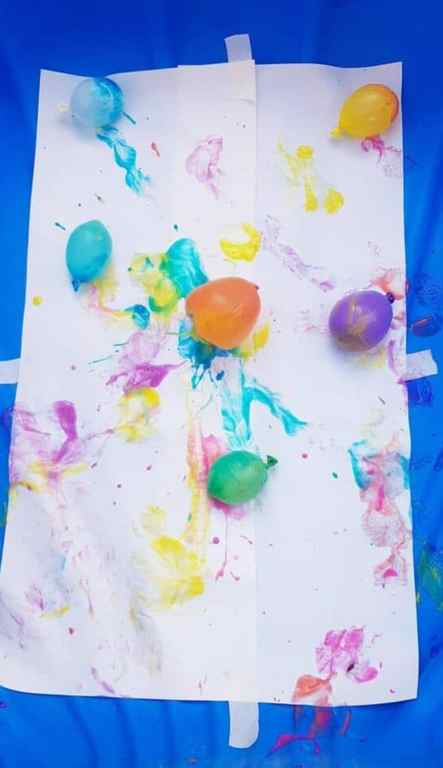 Image shows a piece of paper with balloons and paint. Idea from Lil Tigers