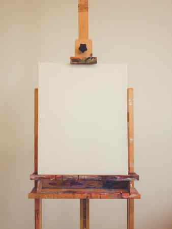 An easel with a primed canvas