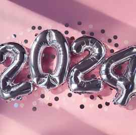 silver numbers 2024 new year balloons in sunlight pink background
