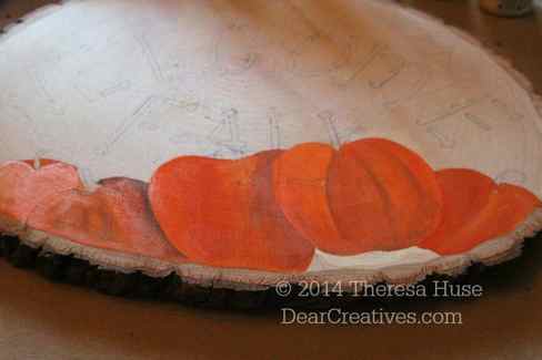 Sketched out design and beginning painting of welcome fall sign with pumpkins_