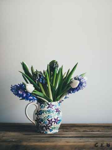 a vase with blue and white flowers - Download Free Stock Photos Pikwizard.com