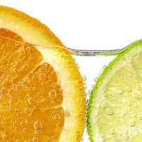 Orange and lime slices in water by Elena Elisseeva