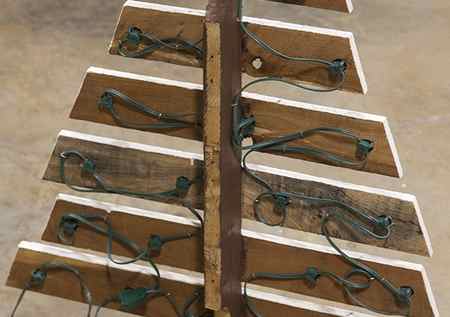 DIY Marquee Pallet Trees Step Eight - Place Light Sockets Through Drill Holes