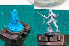 Mold lines on two different miniatures, both in need of removal. One is primed.
