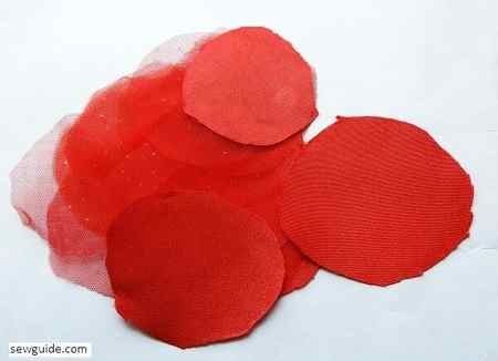cut out circles from satin to make petals for the flowers
