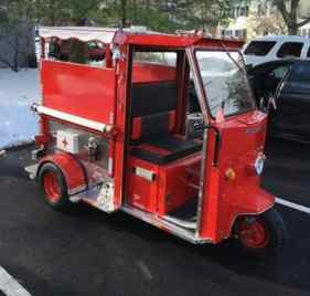 This Tiny Cushman Truckster delivers the frozen goodies with a Fire Department theme.