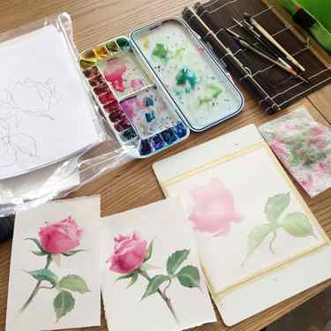 Studio setup of painting a rose in watercolor
