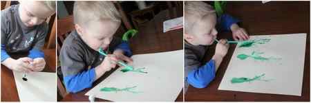 Blowing paint with straws to make a spring flower art project