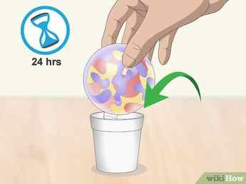Step 6 Set the ornament in a paper cup and let it dry for 24 hours.