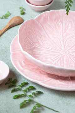 pastel green background with pastel pink bowl