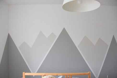 Looking for an amazing kids room or nursery decor idea? DIY this painted mountain range mural - easy and budget friendly! Perfect for a graphic, black and white, camping, adventure style room. Head on over to the blog for the full how-to tutorial. 