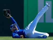 Toronto Blue Jays centre fielder Kevin Kiermaier makes a diving catch against the Baltimore Orioles in the fourth inning during spring training at TD Ballpark on March 11, 2023.