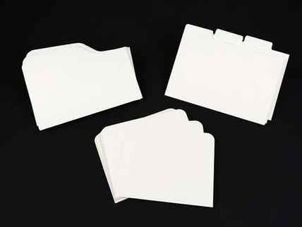 A collection of index cards on a black background.