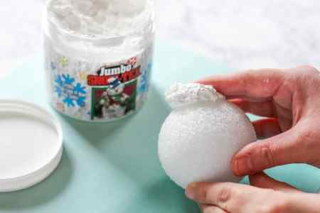 Learn How to Make Sparkle Snow Texture Balls in two steps with less than 5 supplies. These snowballs are great for decorating your home for the holidays.