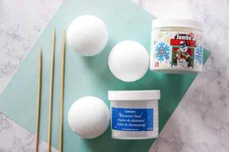 Learn How to Make Sparkle Snow Texture Balls in two steps with less than 5 supplies. These snowballs are great for decorating your home for the holidays.
