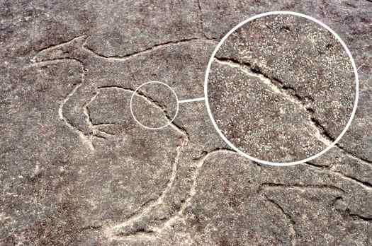 Detail of Ancient Aboriginal carving technique on rock.