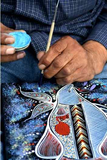 Aboriginal artist painting dots