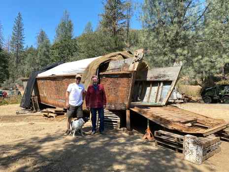 James Dunsdon, left, and Eric Hollenbeck pose in front of the Higgins boat before any work began. (Blue Ox Millworks/Contributed)