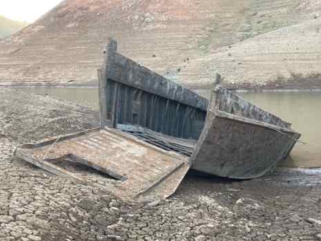 The World War II Higgins boat is shown in a dry portion of Shasta Lake. The boat was removed from the lake and 
