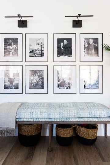 family photo wall ideas, black and white photos above seating