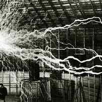 A multiple exposure picture of Tesla with his Magnifying transmitter by American School