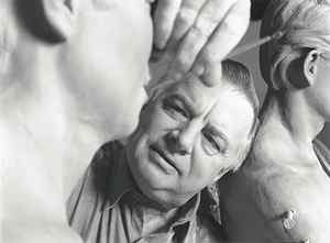 Seward Johnson carving the face of one of his statues