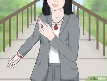 Step 4 Wear a red necklace, bracelet, or ring, to spice up your outfit.