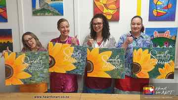 Happy artists with their Sunflower paintings