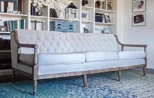 reupholstered couch with weathered finish