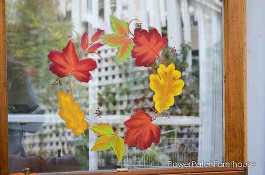 leaves painted in autumn colors on a glass window
