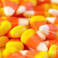 Macro closeup of Halloween traditional Candy Corn treats. by Milleflore Images
