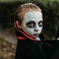 Close Up Of Young Boy Dressed In Dracula Costume On Halloween by Cavan Images
